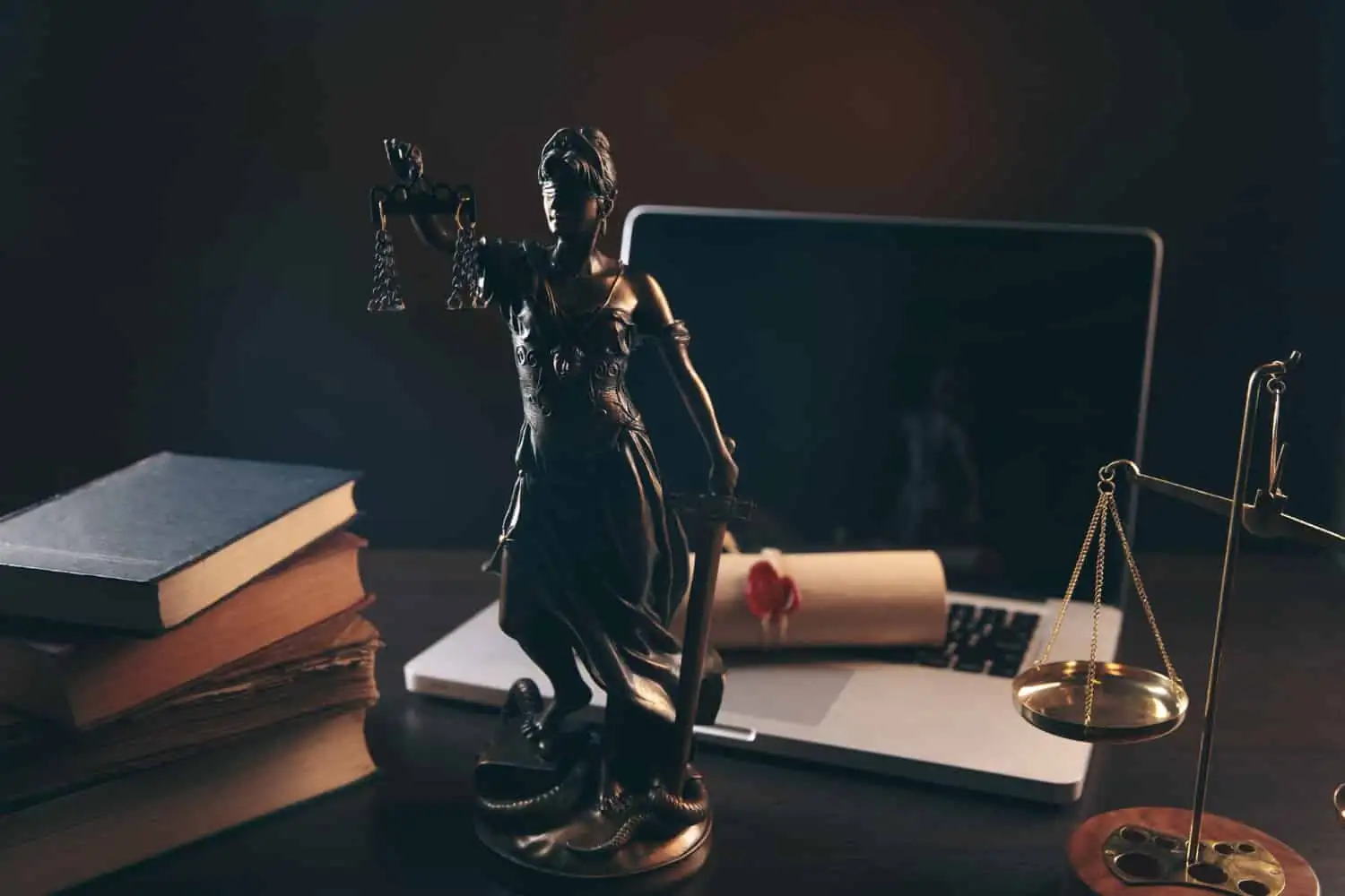Professional defaulters and criminal law 1 - abogado Nerja, abogado Torrox, abogado Velez Malaga, abogado Torre del Mar lawyer office statue justice with scales lawyer working laptop legal law advice justice concept - abogado Nerja, abogado Torrox, abogado Velez Malaga, abogado Torre del Mar